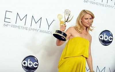 Actress Claire Danes, winner of the Outstanding Lead Actress In A Drama Series award for "Homeland," poses backstage at the 64th Primetime Emmy Awards Sunday, Sept. 23, 2012, in Los Angeles. (photo credit: Jordan Strauss/Invision/AP)