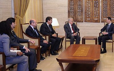 The new UN-Arab League envoy to Syria Lakhdar Brahimi, second from the right, meets with President Bashar Assad in Damascus on Saturday (photo credit: AP/SANA)