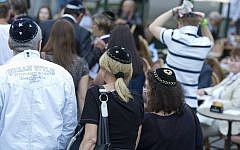 Berlin residents wear kippot in solidarity with a local rabbi who was brutally attacked in August 2013 (photo credit: AP/Michael Gottschalk)