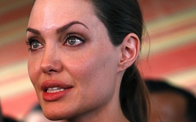 The UN refugee agency's special envoy, actress Angelina Jolie, speaks to the press during her visit to the Zaatari Syrian Refugees Camp, in Mafraq, Jordan, Tuesday, September 11, 2012.  (photo credit: Mohammad Hannon/AP)