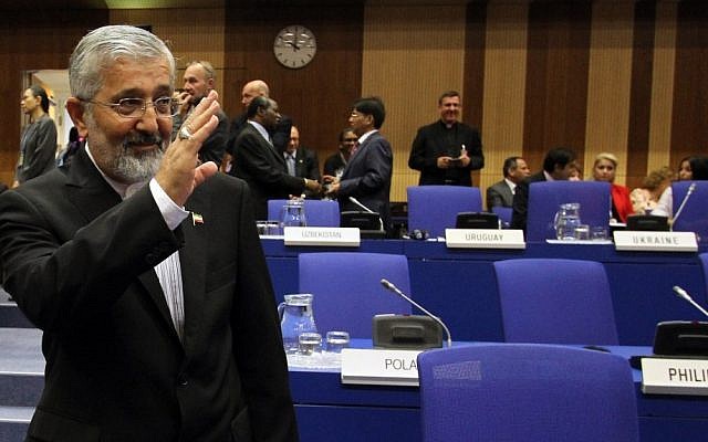 Iran's ambassador to the International Atomic Energy Agency Ali Asghar Soltanieh waves as he arrives for the IAEA board of governors meeting in Vienna on September 11, 2012 (photo credit: AP/Ronald Zak)