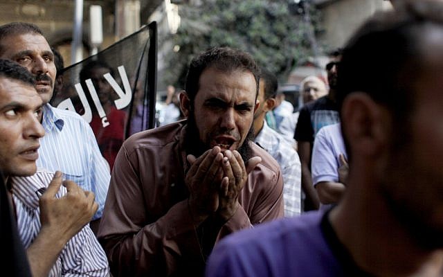 Egyptians protest outside the American embassy in Cairo, September 12 (photo credit: AP/Nasser Nasser) Egyptians protest outside the American embassy in Cairo, September 12 (photo credit: AP/Nasser Nasser)