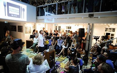 The first Slideluck Potluck in Tel Aviv (photo credit: Casey Kelbaugh)
