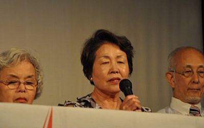 Sugino Nobuko, center, one of the Hibakushas visiting Israel, recounts her personal story of surviving an atomic bombing (photo credit: Michal Shmulovich/Times of Israel)