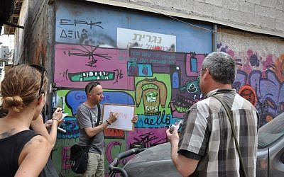 Guy Sharett on his graffiti street tour in Florentin, Tel Aviv (photo credit: Michal Shmulovich) Guy Sharett on his graffiti street tour in Florentin, Tel Aviv (photo credit: Michal Shmulovich)