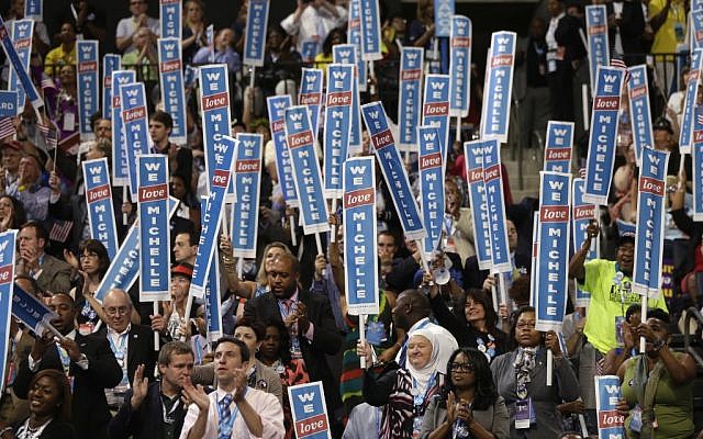Delegates cheer as First Lady Michelle Obama addresses the Democratic National Convention in Charlotte, N.C., on Monday, Sept. 3, 2012. (photo credit: AP Photo/Charles Dharapak) Delegates cheer as First Lady Michelle Obama addresses the Democratic National Convention in Charlotte, N.C., on Monday, Sept. 3, 2012. (photo credit: AP Photo/Charles Dharapak)