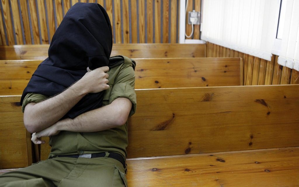 Illustrative: An IDF soldier sits in a military court. (Tsafrir Abayov/Flash90) Illustrative: An IDF soldier sits in a military court. (Tsafrir Abayov/Flash90)