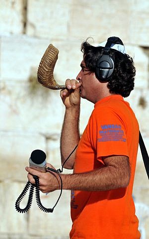 Recording the sounds of the Shofar at the Western Wall (illustrative photo credit: Shay Levy/Flash 90)