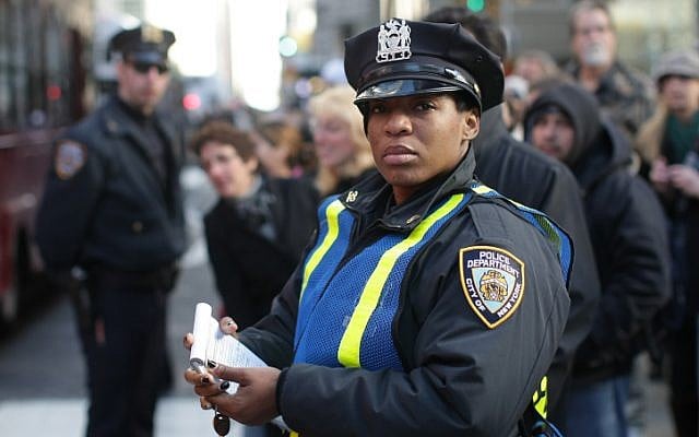 A policewoman stands guard in the middle of the street, in Manhattan, New York. (photo credit: Kobi Gideon/Flash 90)