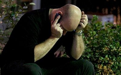 Man speaks on cell phone (Photo credit: Moshe Shai/FLASH90)