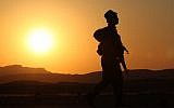 An IDF solider patrols the Egyptian border in 2011 (Nati Shohat/Flash90/File)