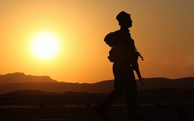 An IDF solider patrols the Egyptian border in 2011 (Nati Shohat/Flash90/File)