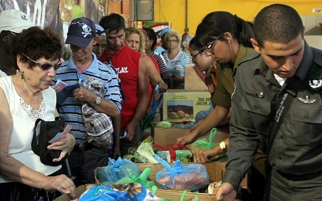 Illustrative photograph of charitable work in Israel (photo credit: Yossi Zamir/Flash90) Illustrative photograph of charitable work in Israel (photo credit: Yossi Zamir/Flash90)
