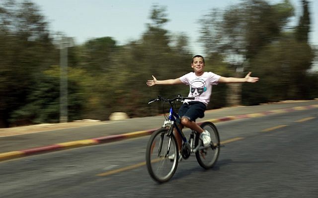 A bike rider on the empty streets of Jerusalem on Yom Kippur, 2011 (photo credit: Uri Lenz/Flash90)