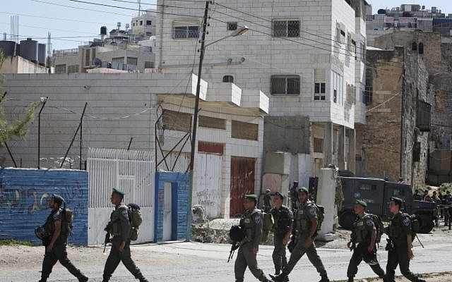 Soldiers patrol the streets of Hebron (illustrative photo credit: Miriam Alster/Flash90)