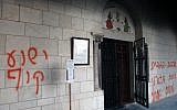 Graffiti sprayed on the Monastery of the Silent Monks at Latrun, calling Jesus a monkey, last Tuesday (photo credit: Yoav Ari Dudkevitch/Flash90)
