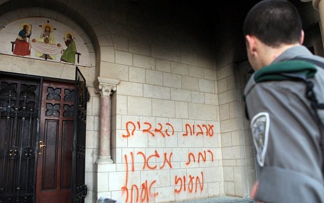 Graffiti sprayed on the Monastery of the Silent Monks at Latrun, Tuesday (photo credit: Yoav Ari Dudkevitch/Flash90)
