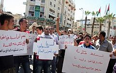 Palestinians demonstrate against the government of Salam Fayyad in Ramallah, September 5 (photo credit: Issam Rimawi/ Flash90)