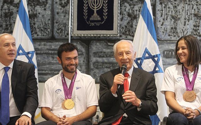 Medalists Noam Gershony (gold, tennis) and Inbal Pezaro (bronze, swimming) with President Shimon Peres and Prime Minister Benjamin Netanyahu at a welcoming ceremony for the Paralympic team at the President's Residence in Jerusalem, in September 2012. (photo credit: Flash90/Miriam Alster) Medalists Noam Gershony (gold, tennis) and Inbal Pezaro (bronze, swimming) with President Shimon Peres and Prime Minister Benjamin Netanyahu at a welcoming ceremony for the Paralympic team at the President's Residence in Jerusalem, in September 2012. (photo credit: Flash90/Miriam Alster)