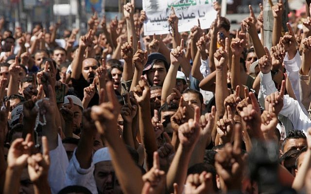 Palestinian men demonstrate against the anti-Islam film "Innocence of Muslims" in Rafah, Gaza Strip on Friday (photo credit: Abed Rahim Khatib/Flash90)