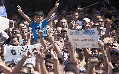 Palestinians take part in a protest against a film mocking Islam at the Damascus Gate in the Old City of Jerusalem, on Friday (photo credit: Yonatan Sindel/Flash90)