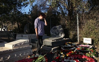 A mourner at Haim Hefer's grave on Wednesday. (photo credit: Avishag Shaar-Yashuv/Flash90)