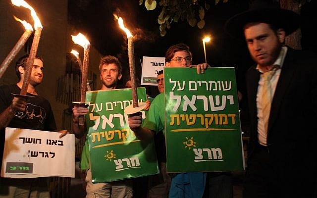 Activists rallying against the time change Saturday night. (photo credit: Yoav Ari Dudkevitch/Flash90)