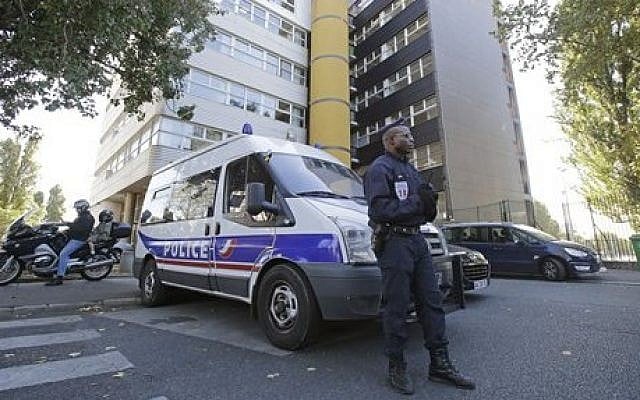 A French policeman stands guard outside the headquarters of the satirical weekly Charlie Hebdo in Paris, September 19, 2012. (AP/Michel Euler) A French policeman stands guard outside the headquarters of the satirical weekly Charlie Hebdo in Paris, September 19, 2012. (AP/Michel Euler)