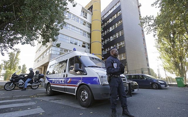 A French policeman stands guard outside the headquarters of the satirical weekly Charlie Hebdo in Paris, Wednesday, September 19, 2012 (photo credit: AP Photo/Michel Euler)