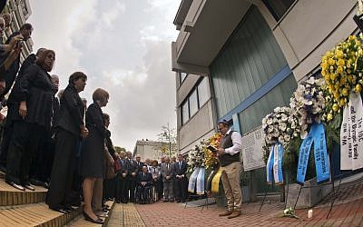 Shay Shapira, son of murdered athletics trainer Amitzur Shapira, right, delivers a speech in front of wreaths at a memorial at the former accommodation of the Israeli Olympic team in Munich, southern Germany, Wednesday, Sept. 5, 2012. (photo credit: dapd, Joerg Koch/AP)