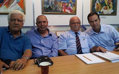 Meir Kahaolon, second from left, president of the World Organization of Libyan Jews, with members Doron Shimon, left, Michael Goren and Zuri Doron Dadosh in the group's offices, May 2012. (photo credit: Courtesy Meir Kahaolon) Meir Kahaolon, second from left, president of the World Organization of Libyan Jews, with members Doron Shimon, left, Michael Goren and Zuri Doron Dadosh in the group's offices, May 2012. (photo credit: Courtesy Meir Kahaolon)