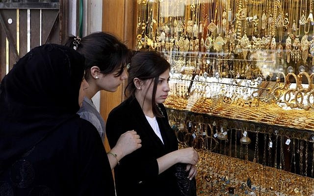 Iraqi woman look at jewelry at a marketplace in Kazimiyah neighborhood, northern Bagdad on Sunday, Sept 2 (photo credit: AP/Karim Kadim)