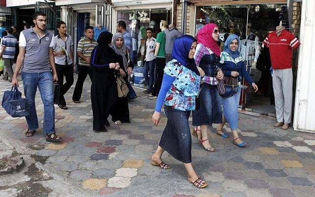 Iraqis shop at a marketplace in northern Baghdad's Kazimiyah neighborhood on Sunday, September 2 (photo credit: AP/Karim Kadim) Iraqis shop at a marketplace in northern Baghdad's Kazimiyah neighborhood on Sunday, September 2 (photo credit: AP/Karim Kadim)