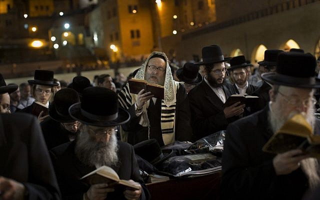Ultra-Orthodox Jews pray at the Western Wall in Jerusalem's Old City, before the start of the holiday of Rosh Hashanah on Sunday. (photo credit: AP/Bernat Armangue)
