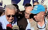 Lakhdar Brahimi (left) during his visit to the Zaatari refugee camp in Jordan, September 18 (photo credit: AP/Raad Adayleh)
