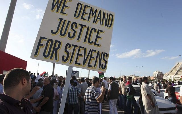 Libyans protest against Islamic militias in Benghazi, a week after the attack on the US Embassy that killed Ambassador Chris Stevens and three others in September 2012. (photo credit: AP /Mohammad Hannon) Libyans protest against Islamic militias in Benghazi, a week after the attack on the US Embassy that killed Ambassador Chris Stevens and three others in September 2012. (photo credit: AP /Mohammad Hannon)