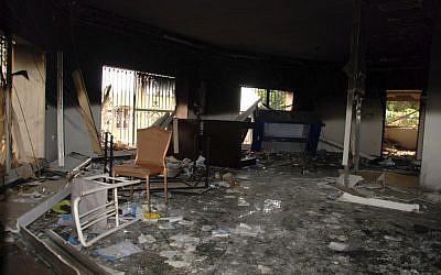 Glass, debris and overturned furniture are strewn inside a room in the gutted US Consulate in Benghazi, Libya, after an attack that killed four Americans, including Ambassador Chris Stevens, Sept. 12, 2012. (photo credit: AP/Ibrahim Alaguri)