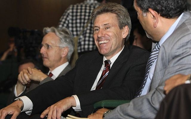 Chris Stevens, center, accompanied by British envoy Christopher Prentice, left, speaks to Council member for Misrata Dr. Suleiman Fortia, right, in April, 2011 (photo credit: AP/Ben Curtis) Chris Stevens, center, accompanied by British envoy Christopher Prentice, left, speaks to Council member for Misrata Dr. Suleiman Fortia, right, in April, 2011 (photo credit: AP/Ben Curtis)