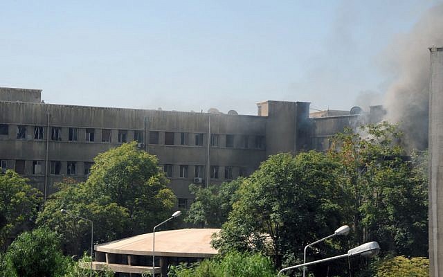 Smoke rising from Syria's army command headquarters in Damascus, Wednesday, after twin blasts rocked the area (photo credit: AP Photo/SANA) Smoke rising from Syria's army command headquarters in Damascus, Wednesday, after twin blasts rocked the area (photo credit: AP Photo/SANA)
