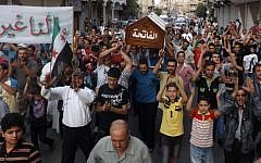 This citizen journalism image provided by Shaam News Network SNN, taken on Friday, Aug. 31, 2012, purports to show the funeral of Ahmed Ismail Zaqzuq, killed in fighting with pro-government forces in Damascus. (photo credit: AP)