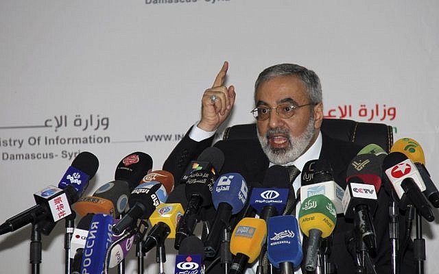 Syrian Information Minister Omran al-Zoubi speaks during a press conference in Damascus, Syria, September, 2012. (photo credit: AP/Bassem Tellawi) Syrian Information Minister Omran al-Zoubi speaks during a press conference in Damascus, Syria, September, 2012. (photo credit: AP/Bassem Tellawi)