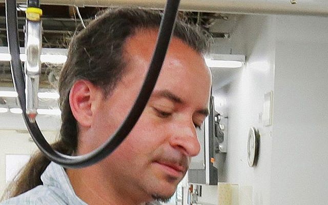 This July 2012 photo shows suspected shooter Andrew Engeldinger at work at Accent Signage in Minneapolis. (photo credit: Bill Klotz/AP, Finance and Commerce)