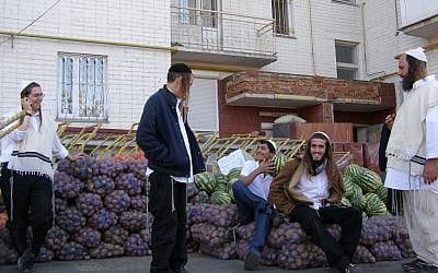 Partners of a small catering business moving vegetables to their kitchen in Uman’s Pushkina neighborhood, Sept 10, 2012. (photo credit: Cnaan Liphshiz/JTA)
