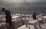 Ultra-Orthodox Jews visit graves at the cemetery on the Mount of Olives, September 2012. (Yonatan Sindel/Flash90)