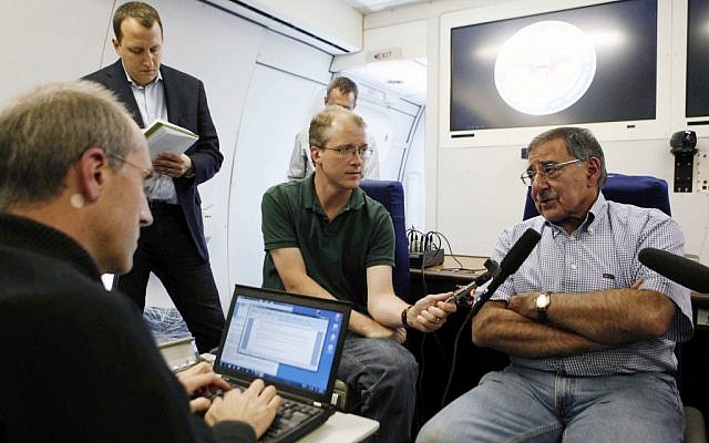 US Secretary of Defense Leon Panetta, right, speaks to the media aboard his aircraft on way to an official visit to Japan, China and New Zealand, Saturday, Sept. 15, 2012. (photo credit: AP/Larry Downing)