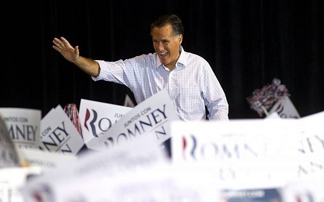 Republican presidential candidate Mitt Romney waves to supporters before making a speech in Miami on Wednesday (photo credit: AP/J. Pat Carter) Republican presidential candidate Mitt Romney waves to supporters before making a speech in Miami on Wednesday (photo credit: AP/J. Pat Carter)