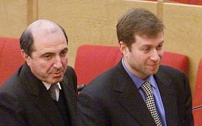 In this Jan. 26, 2000 file photo Russian tycoons Boris Berezovsky, left, and Roman Abramovich, then both lawmakers, walk after the session of the State Duma, parliament's lower house, in Moscow, Russia. (photo credit: AP)