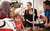 UNHCR Special Envoy Angelina Jolie meets with Syrian refugee families in an undisclosed refugee camp close to the Syrian border in eastern Turkey Thursday, Sept. 13 (photo credit: AP/UNHCR, Jason Tanner)