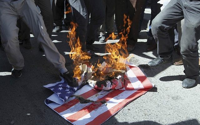 Islamists burn a mock US flag near the US Embassy in Ankara, Turkey, in September (photo credit: AP/Burhan Ozbilici) Islamists burn a mock US flag near the US Embassy in Ankara, Turkey, in September (photo credit: AP/Burhan Ozbilici)