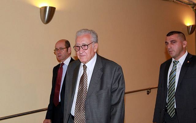 Lakhdar Brahimi, center, joint special representative for Syria, arrives at closed door consultations regarding the situation in Syria at the Security Council at United Nations headquarters Monday, Sept. 24 (photo credit: AP/David Karp)